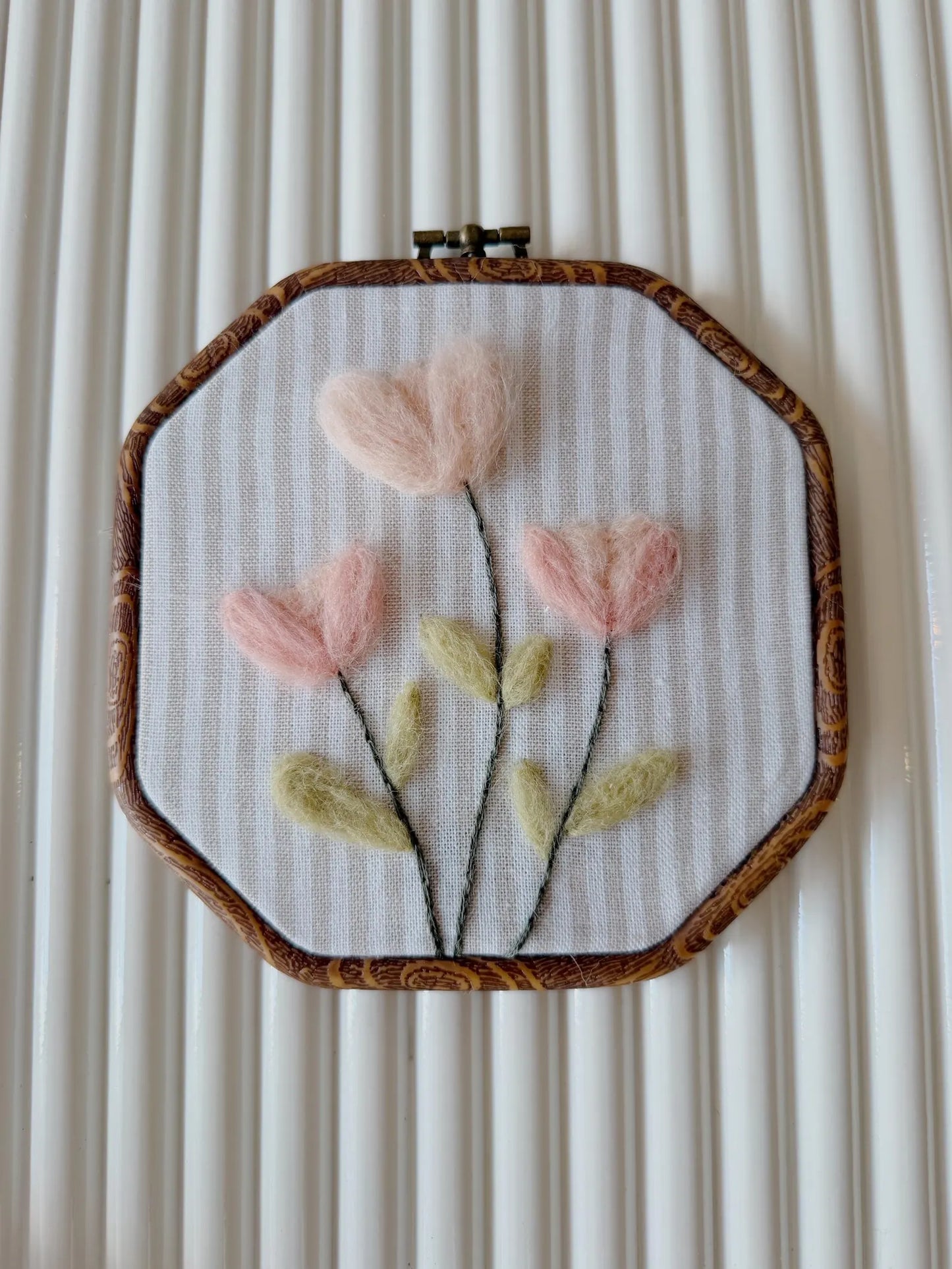 Blush felted flowers on a wooden hoop