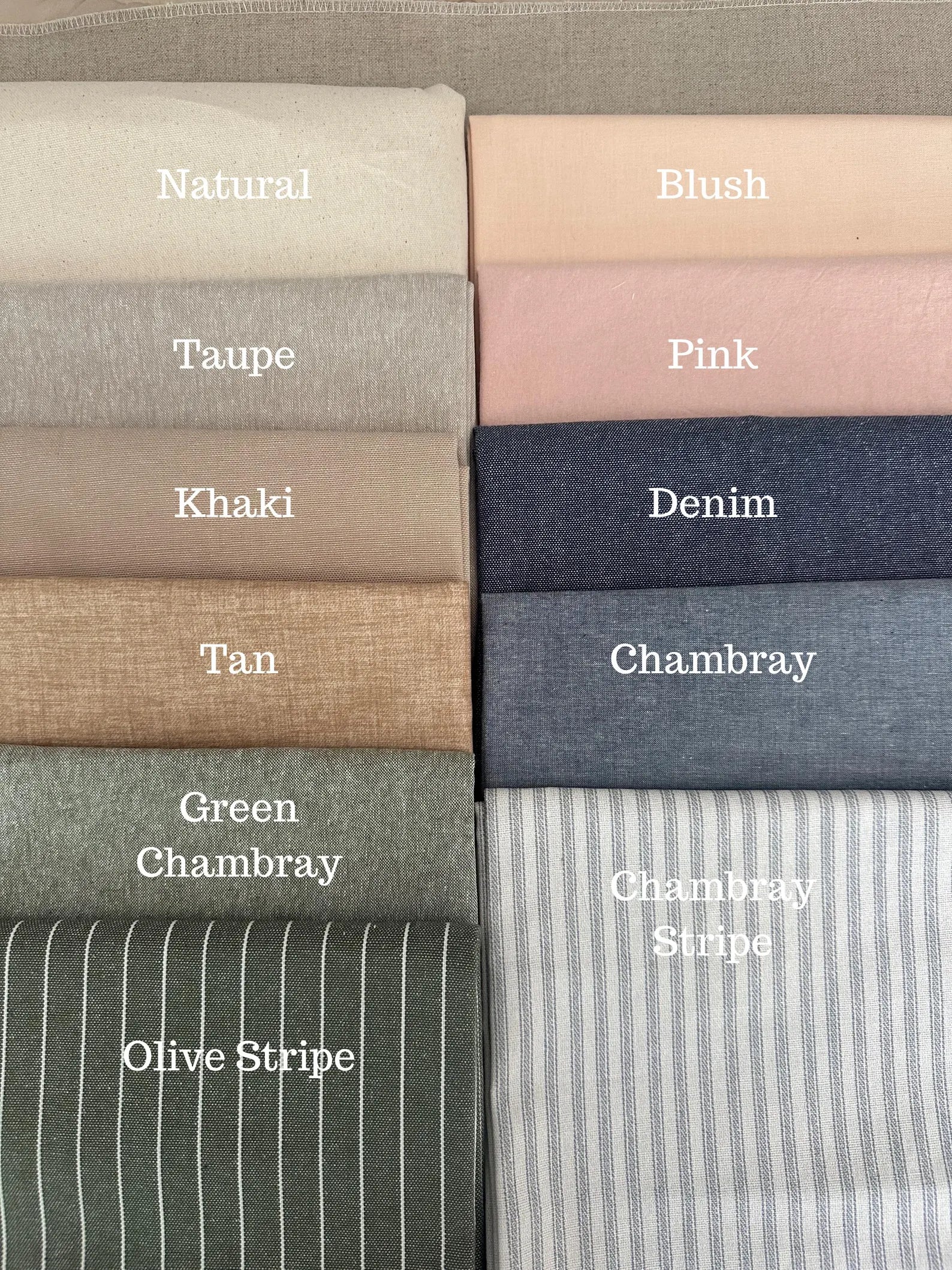 Collection of folded fabric swatches in various colors with labels.